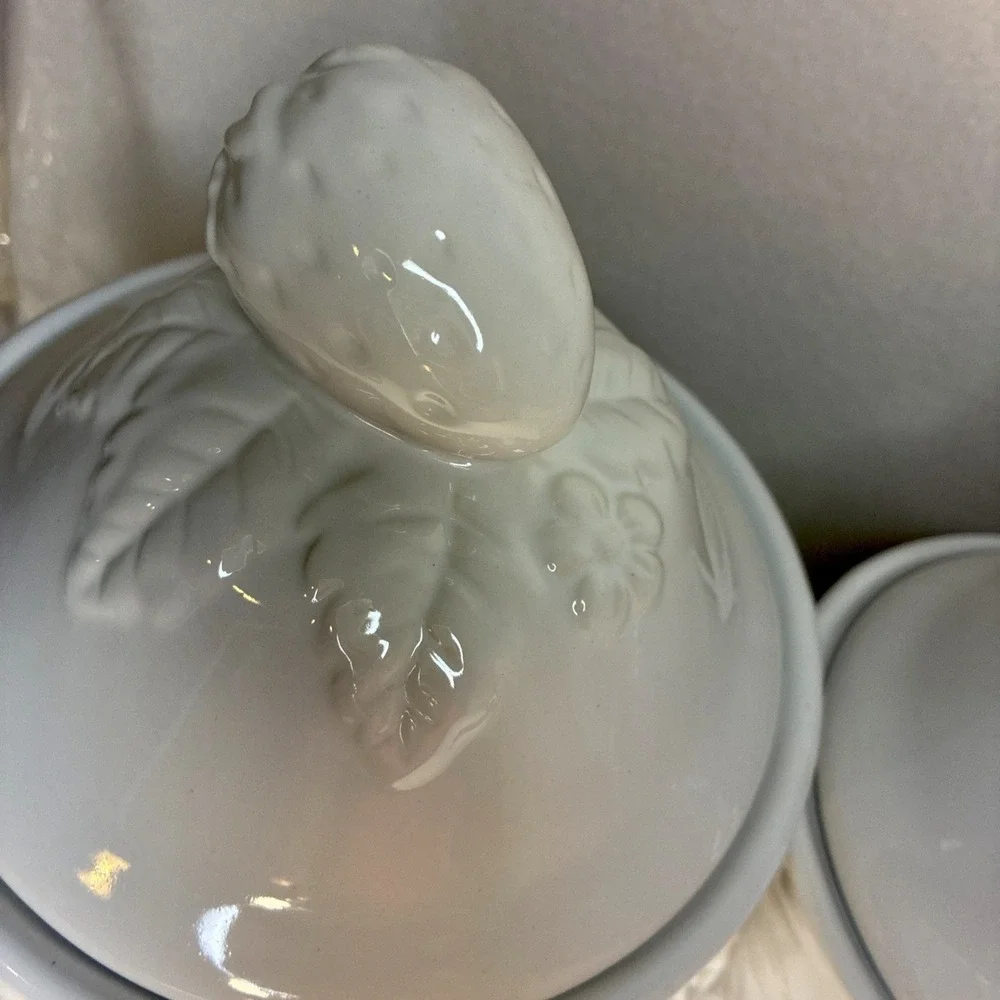 Set of  4 Vintage White Lidded Ceramic Canisters,  Grapevine and Strawberry Lid.